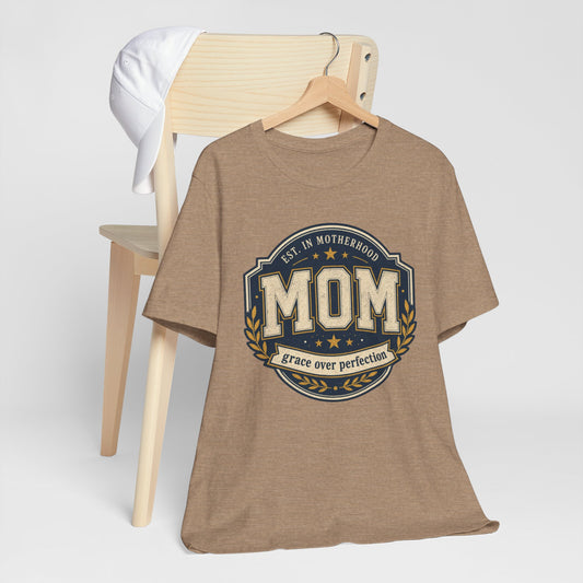 Mom Vintage Emblem Tee — "Grace Over Perfection" Mother's Day Shirt - Deep Heather - Pearl & Wings